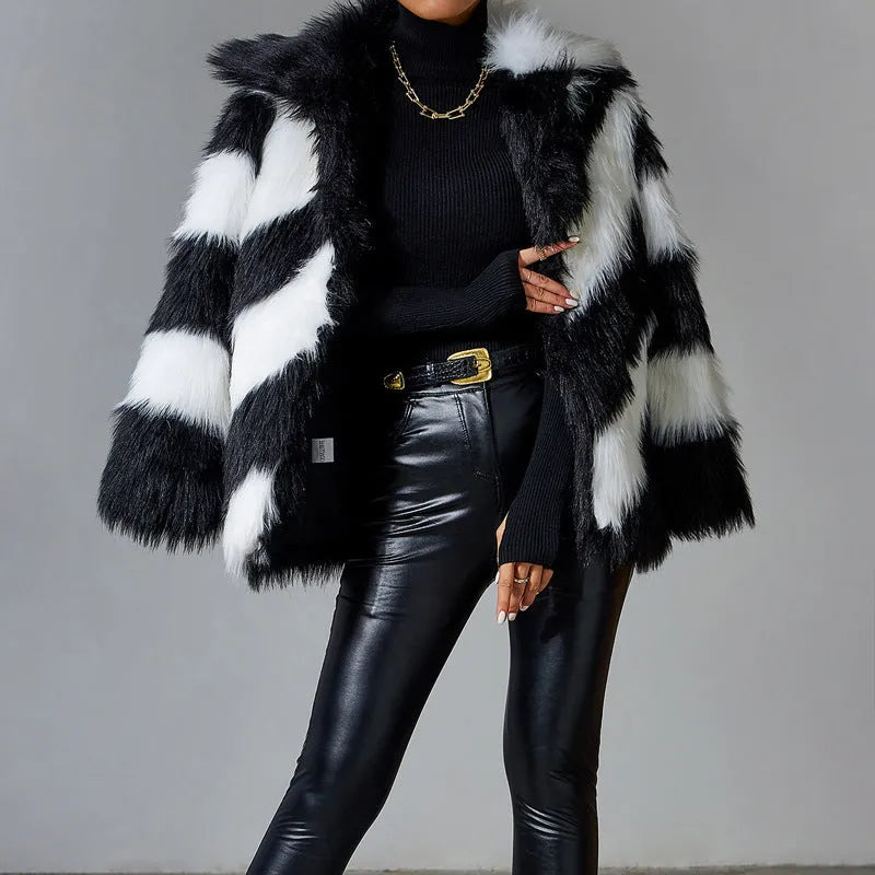 Picture Colour faux fur coat with dark contrast lapels and a matching fur collar.