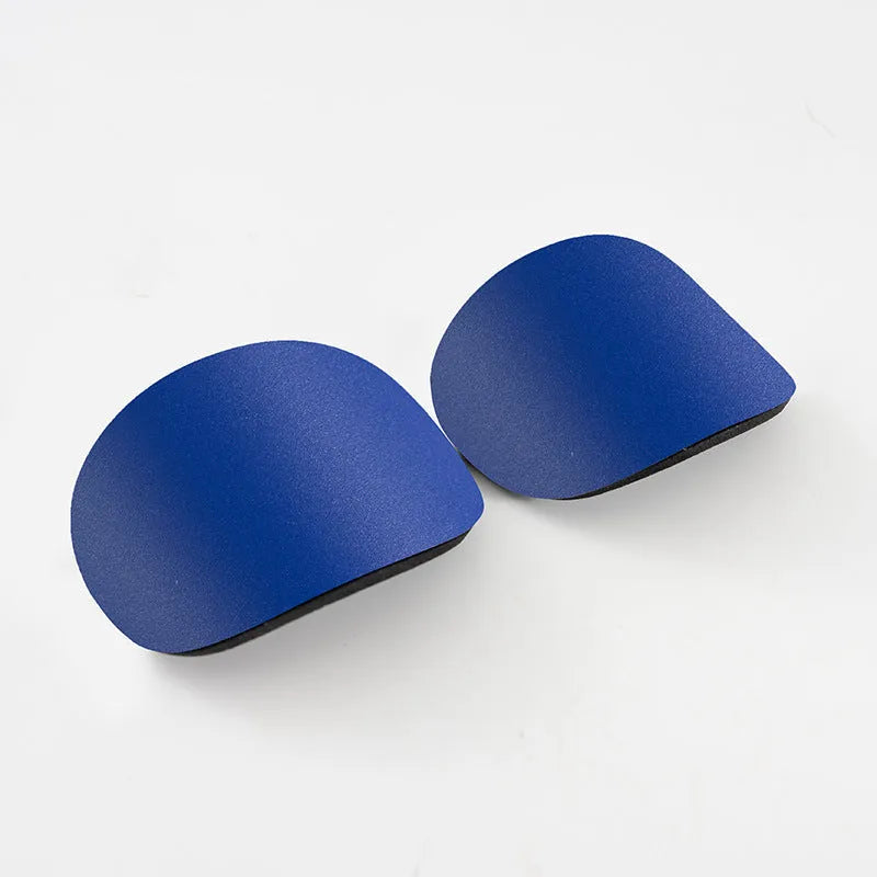 PU mini shin guards in various colours on a leg, showing S and XS sizing for sports protection.