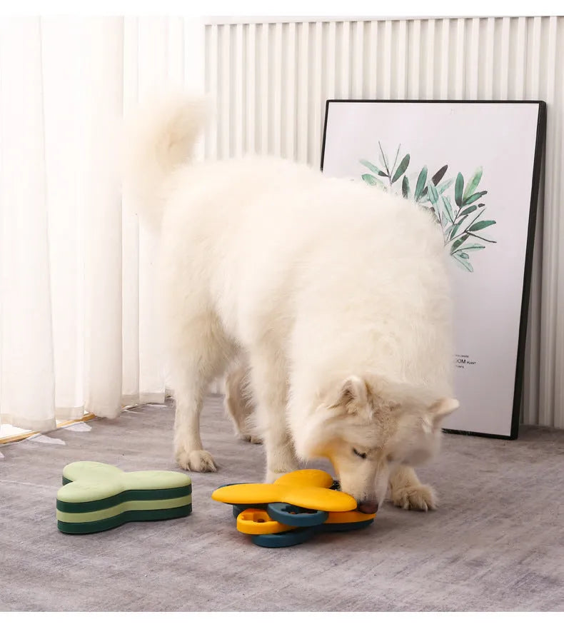 Green and yellow dog puzzle toy with rotatable compartments and bone-shaped covers