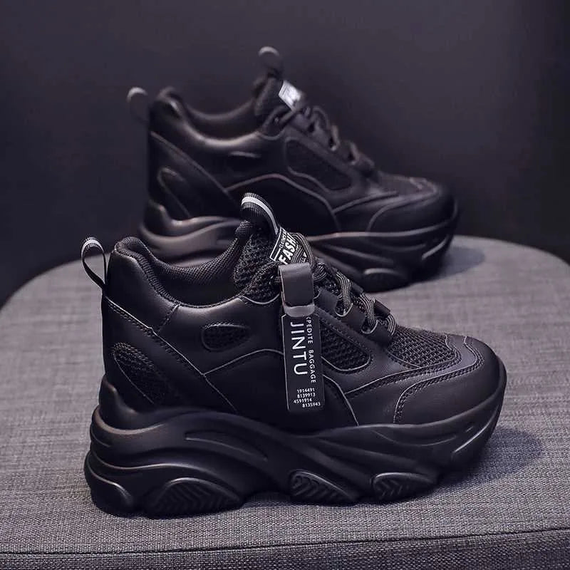 Women's black mesh platform casual shoes with hollow out details and a toe holder.