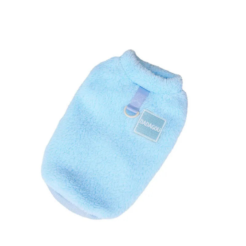 Fluffy blue coral fleece pet jacket with multi-coloured pull ring fastening on a dog model.