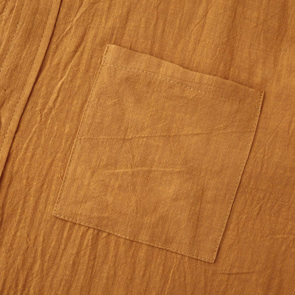 Men's brown slim fit long sleeve cotton blend shirt laid flat.