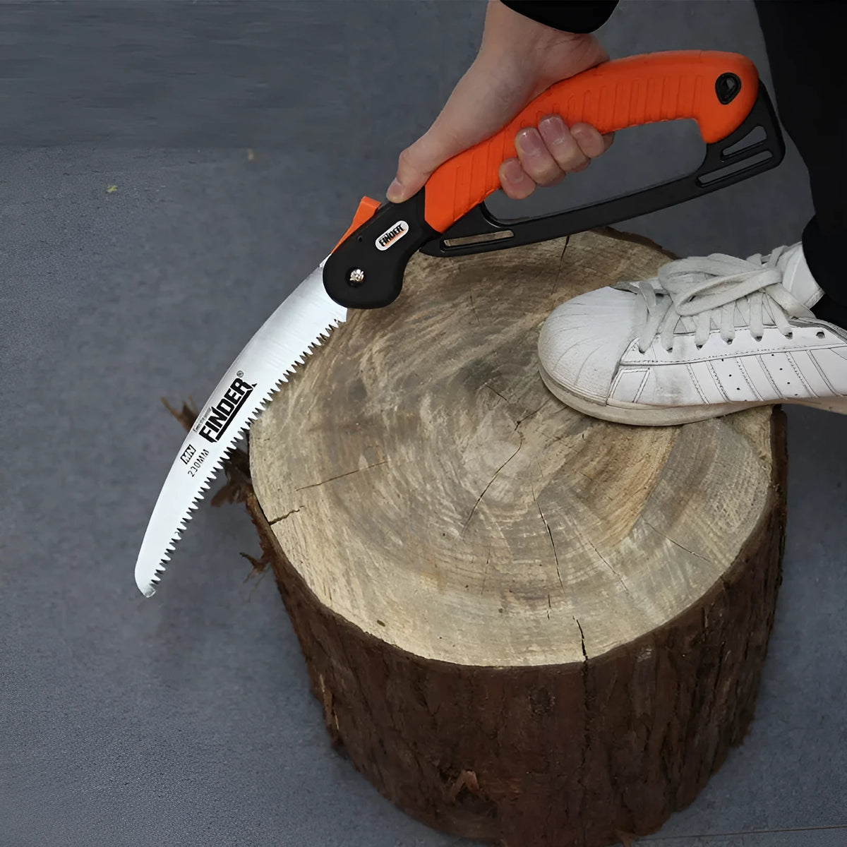 230mm folding hand saw with TPR grip extended for cutting with measurements showing