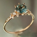Gold plated geometric ring with claw inlaid zircon stones in chamfered square pattern