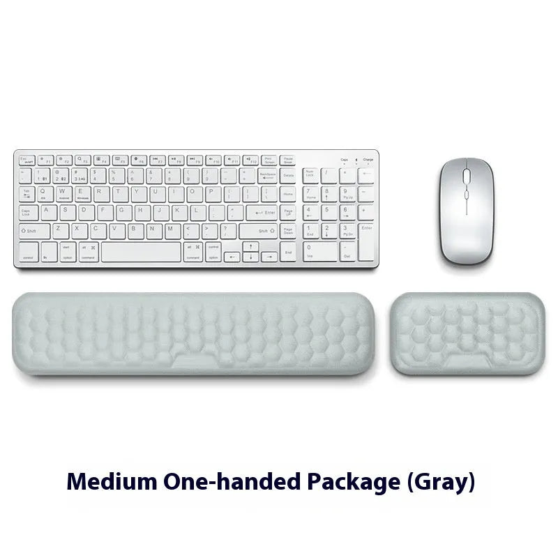 Memory foam mouse wrist pad with silicone bottom in black cloth cover on computer desk