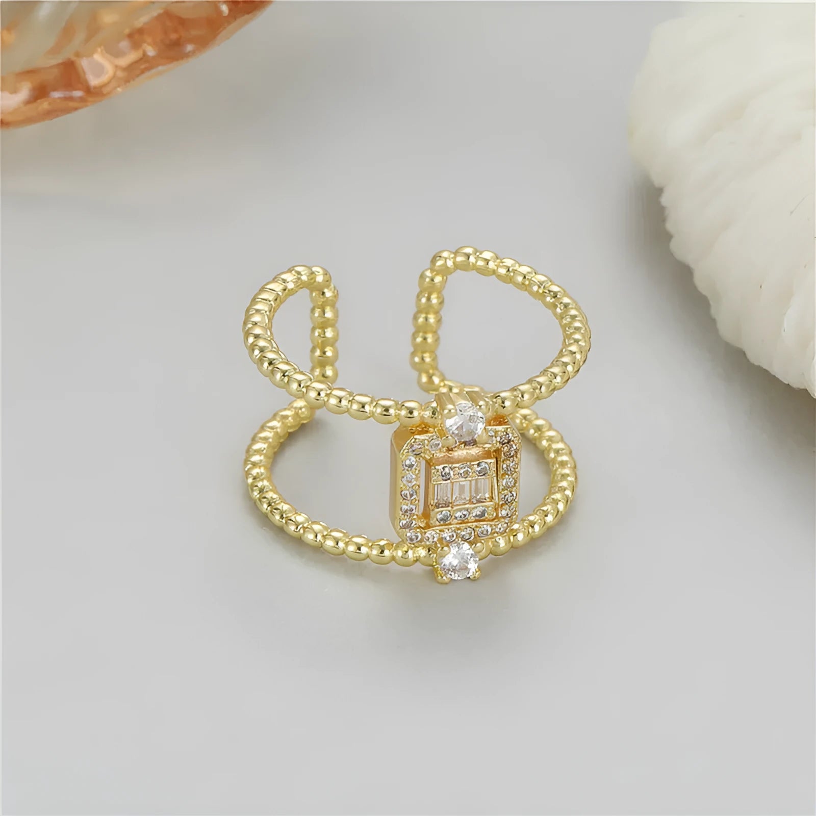 Adjustable open ring with U-shaped asymmetric design in 14K copper-plated gold finish