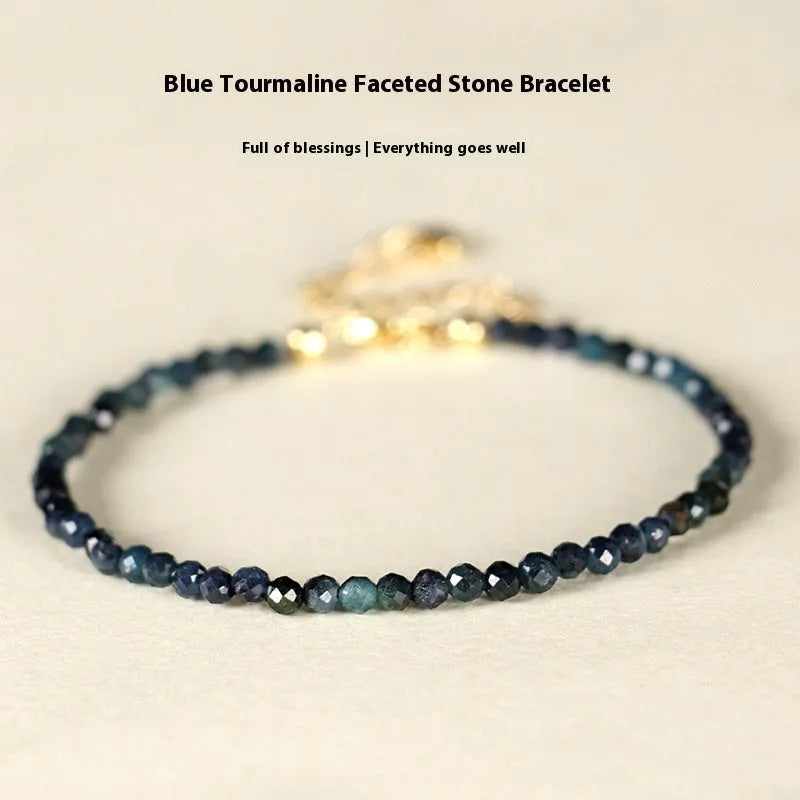 Blue tourmaline bracelet with 3mm cut beads and spacer bead design
