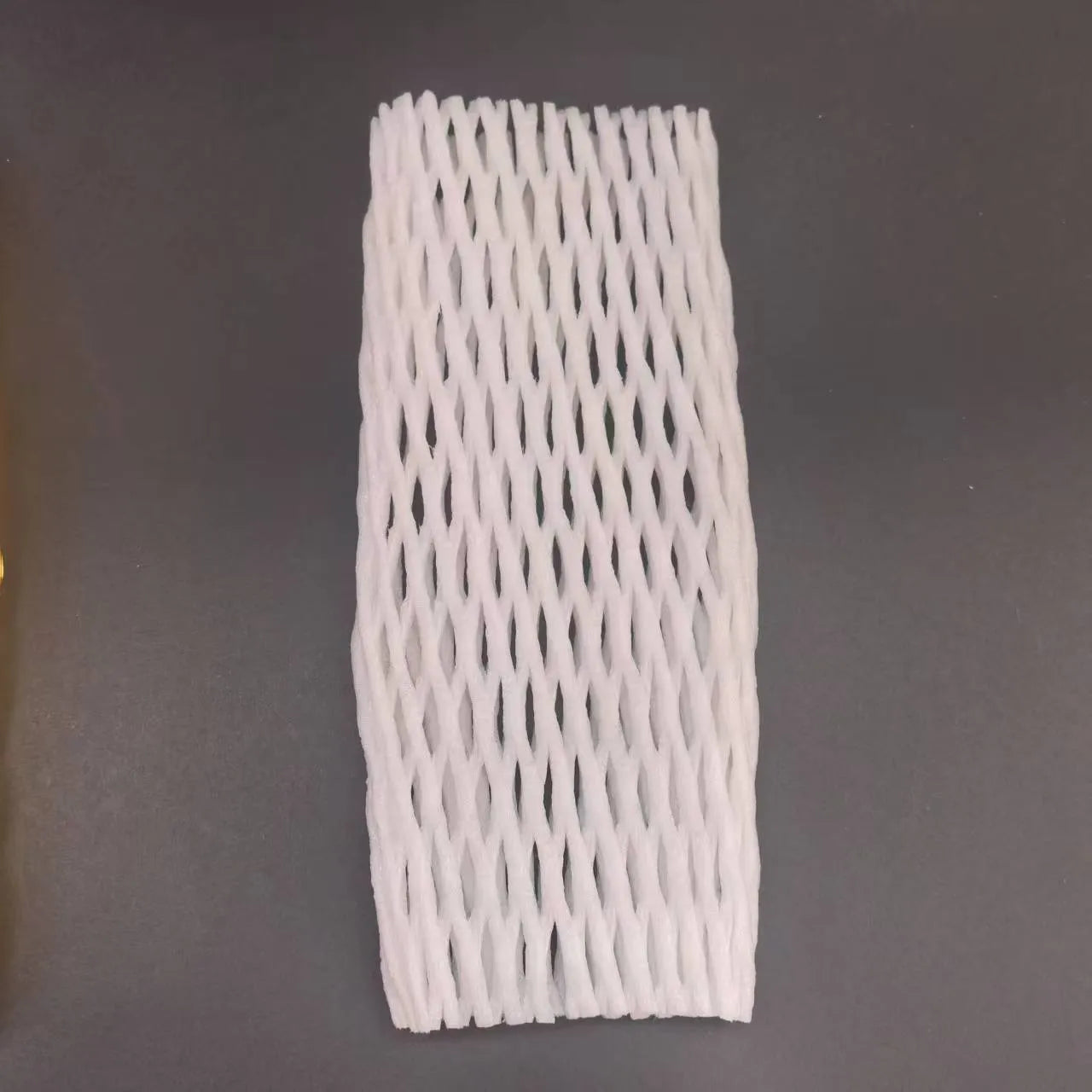 White foam net covers for fruit protection in multiple sizes on various fruits