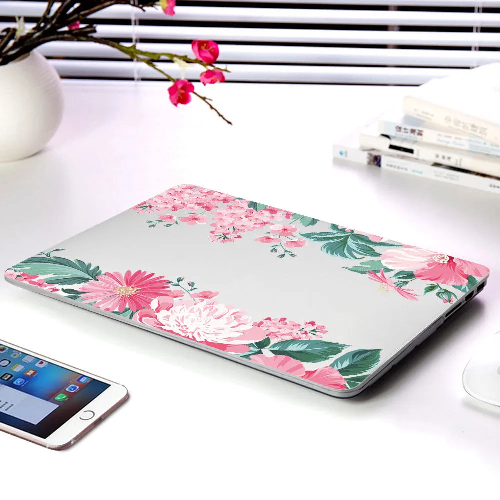 Hard plastic laptop protective shell with a partial floral print design for MacBook Air and Pro models.