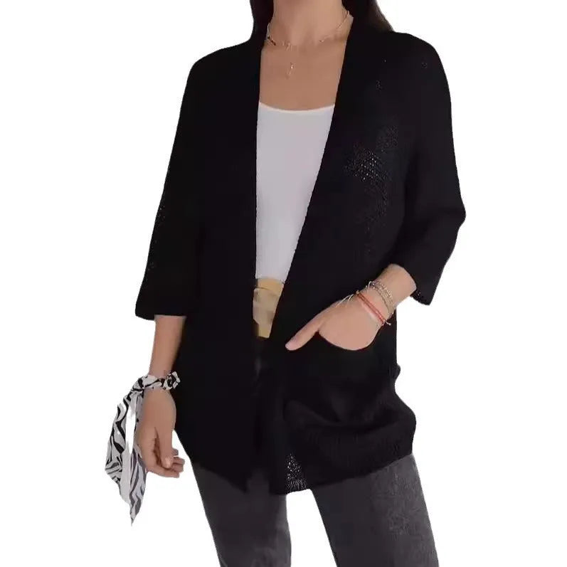 Women's army green waffle knit cardigan coat with nine-quarter sleeves and pockets.
