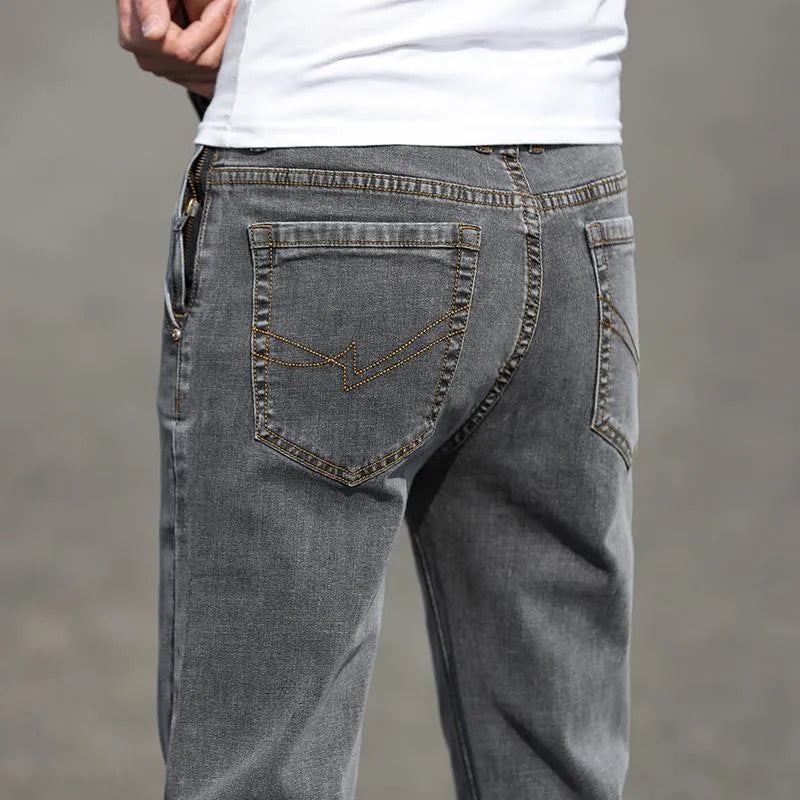 Men's straight leg jeans in smoky gray colour with low waist and zipper fly closure