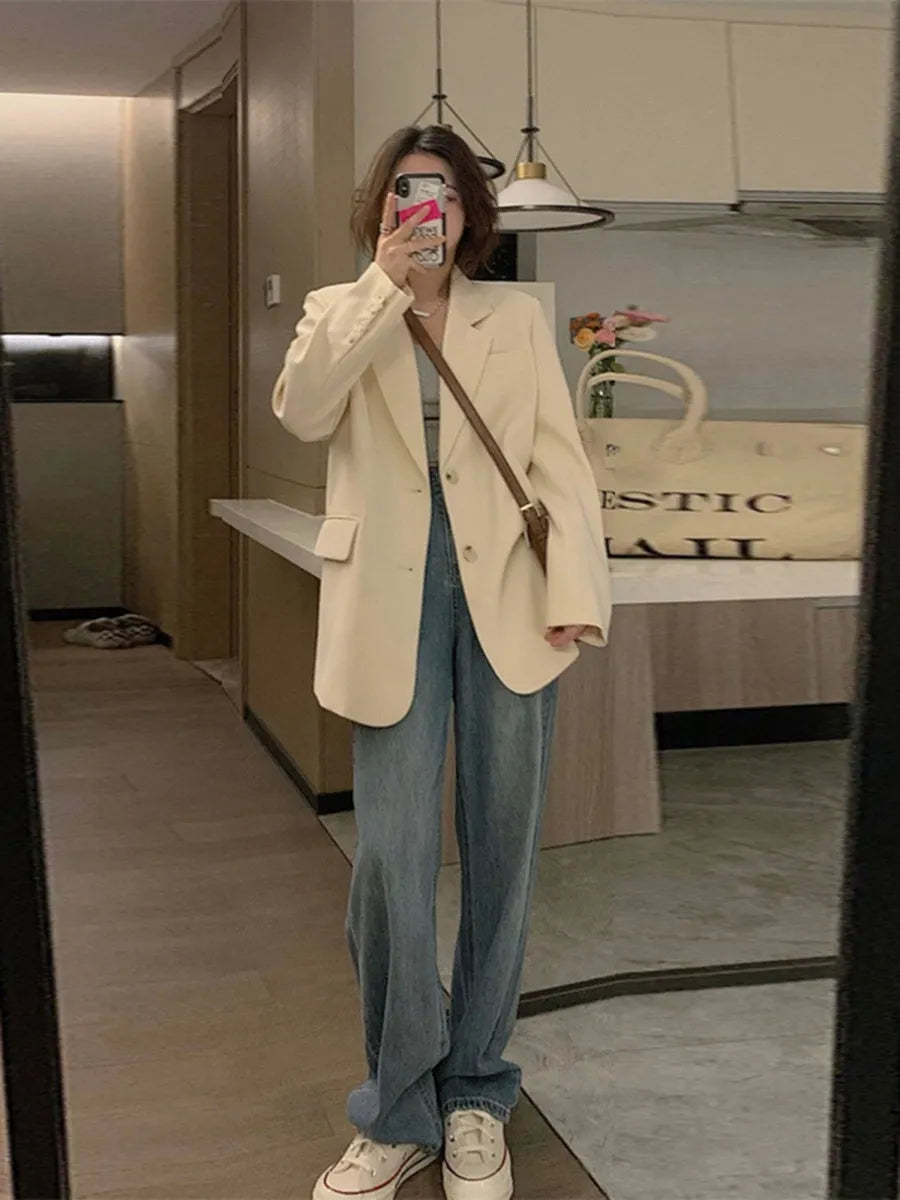 Korean style solid colour polyester blazer on a hanger, showing long sleeves and a chest pocket.