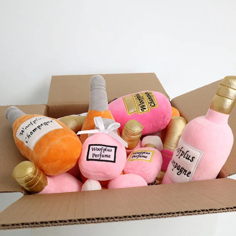 Soft plush pet toy shaped like a wine bottle, shown in various colours including green, red, and black.
