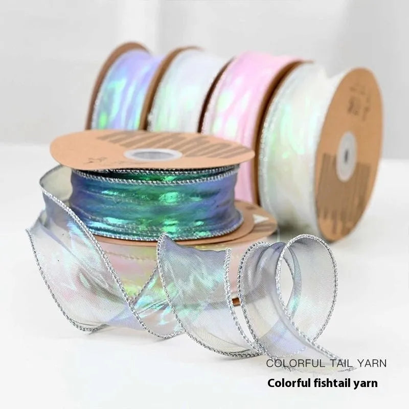Roll of 4cm wide fishtail yarn mesh ribbon in a choice of eight illusion colours for craft and floral use.