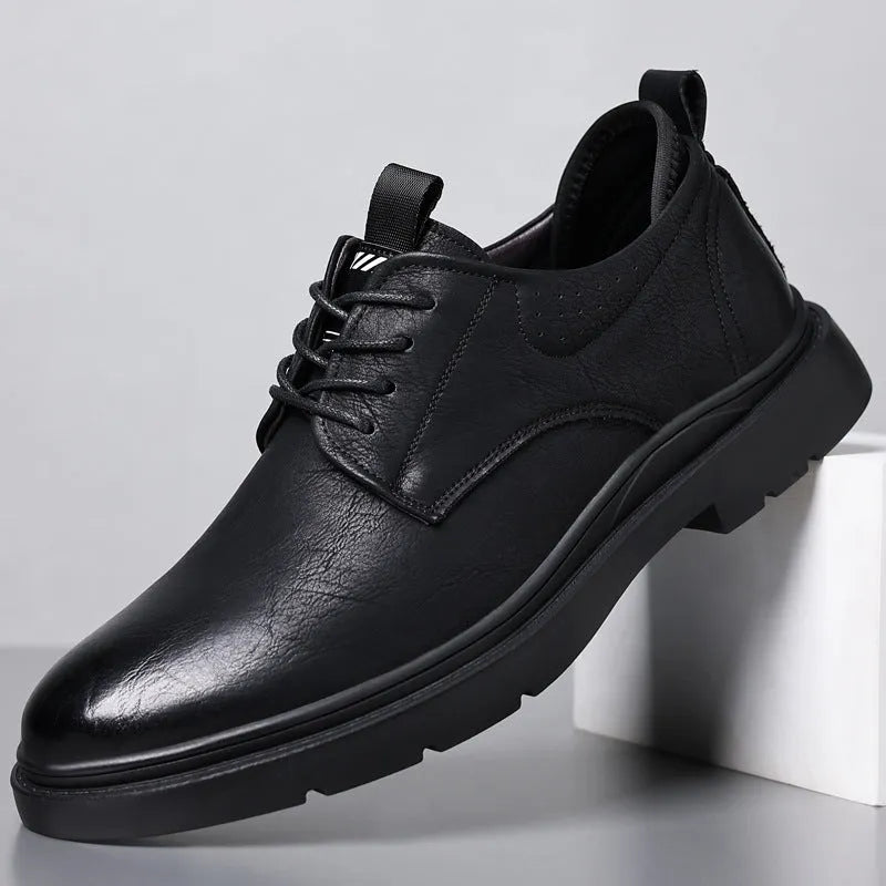 Men's black and brown leather casual shoes with a cowhide upper and rubber sole.