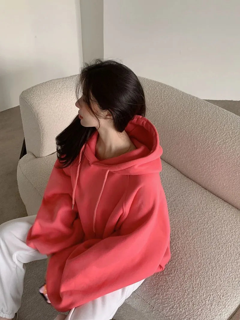 Watermelon red women's loose hooded pullover sweater made from mulberry silk fabric.