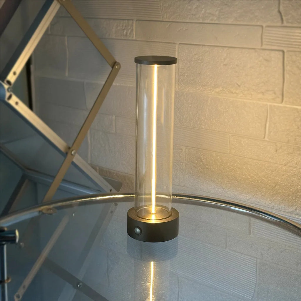 Modern rectangular LED light strip with frosted glass panel, shown with USB cable for charging.