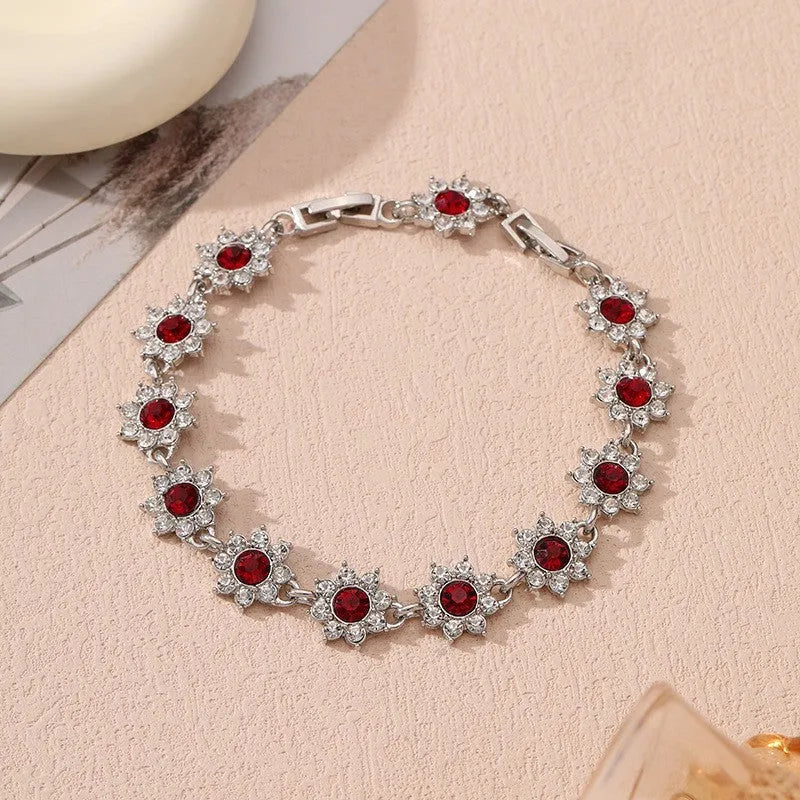 Floral coloured gemstone bracelet in zinc alloy with electroplated gold and silver crystal finishes.