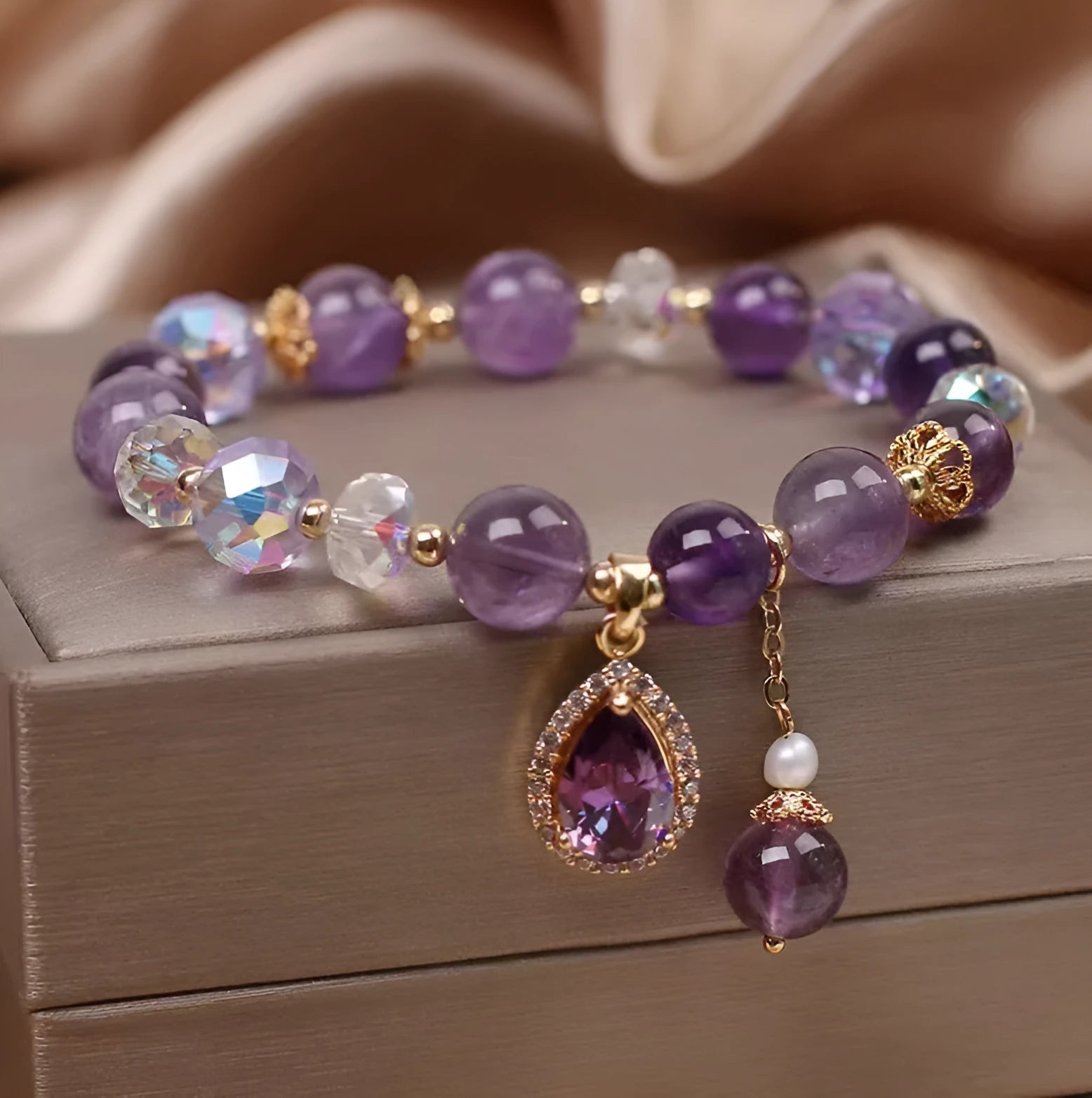 Close-up of a women's bracelet with natural purple amethyst stones set using micro inlay craftsmanship.