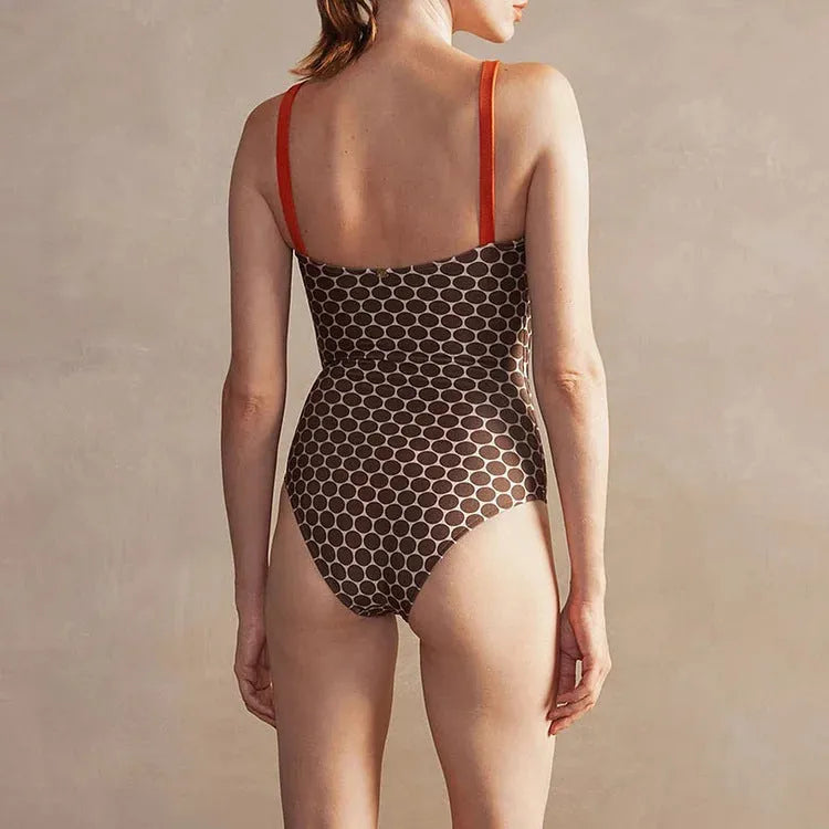 Dot printed one-piece swimsuit with matching wrap skirt in polyester fabric
