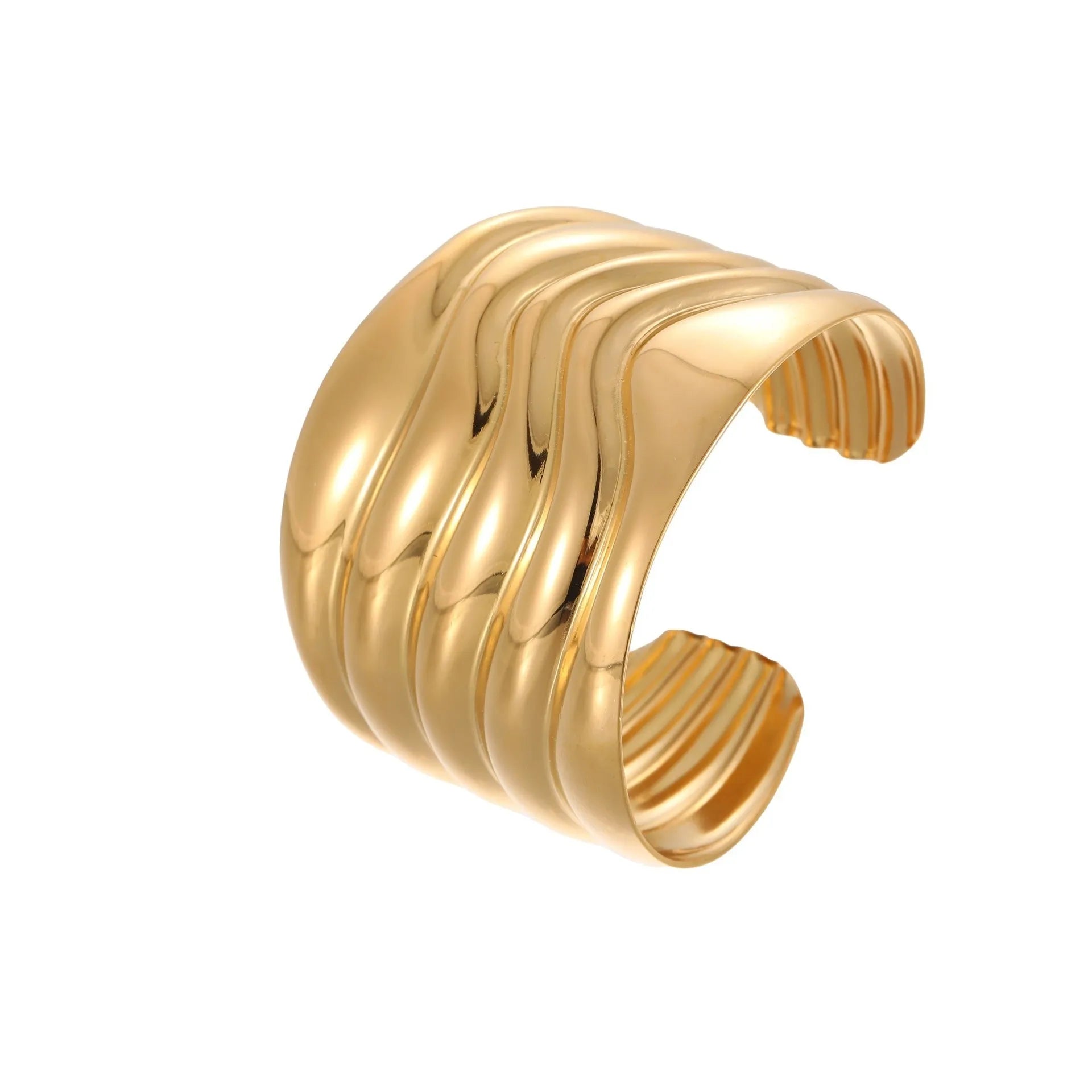 Gold-plated stainless steel bracelet with asymmetric geometric wave design and wide opening.