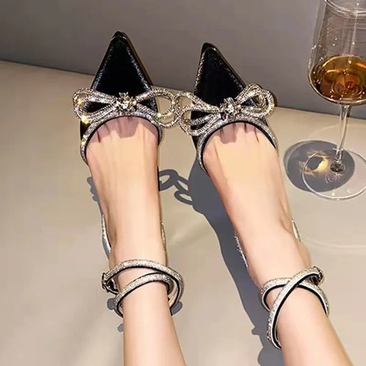 Women's black French style stiletto sandals with a silk bandage across the ankle and an adjustable buckle.