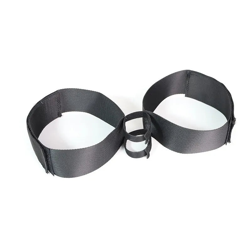 Black adjustable adult toy strap made from knitted belt material for intimate use