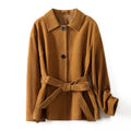 Women's retro style cashmere coat with Peter Pan collar and leather stitching details in loose fit mid-length design