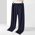 Man wearing black ice silk loose straight-leg trousers with a high elasticity open waist.