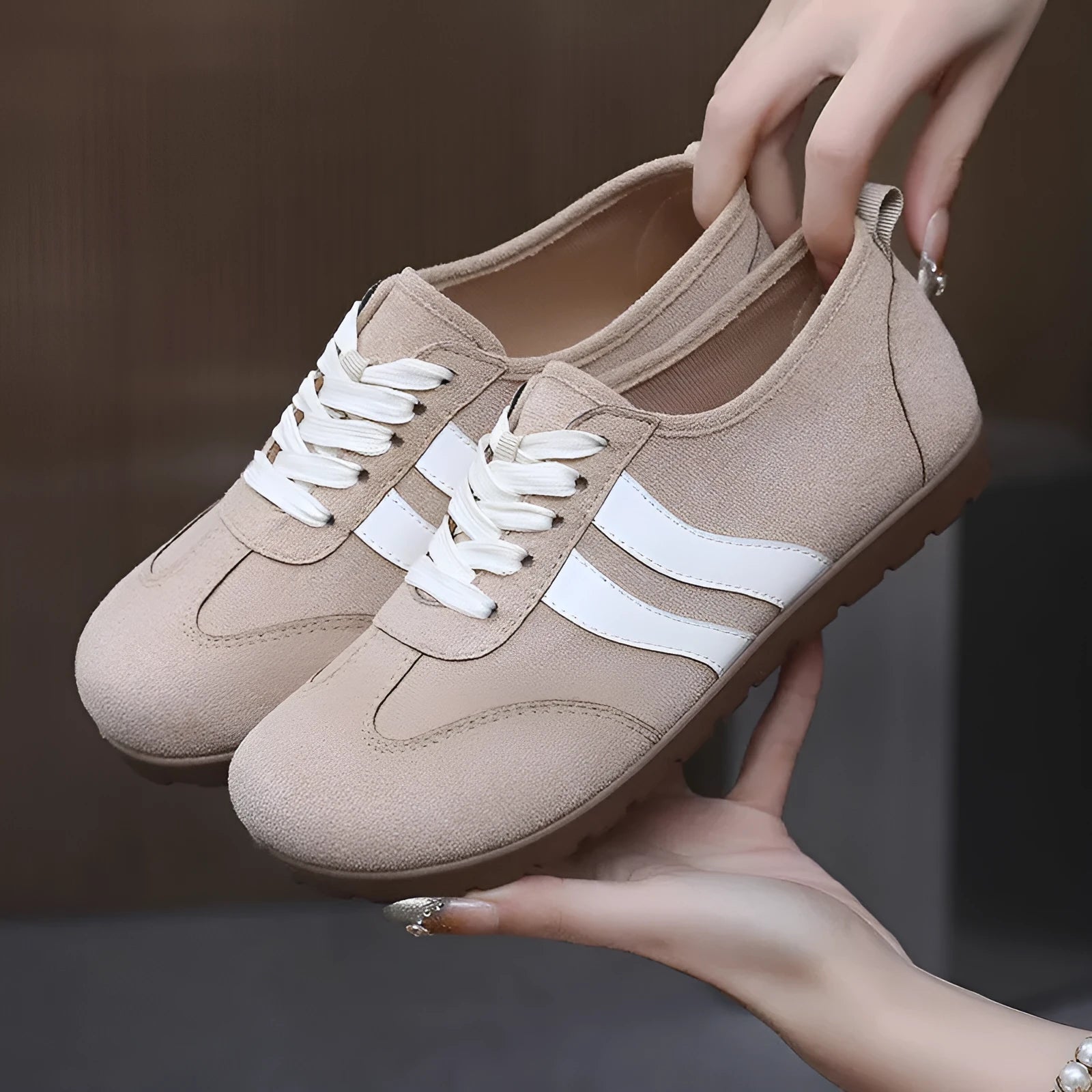 Women's vintage-style canvas sneakers with a round toe and soft rubber flat sole.
