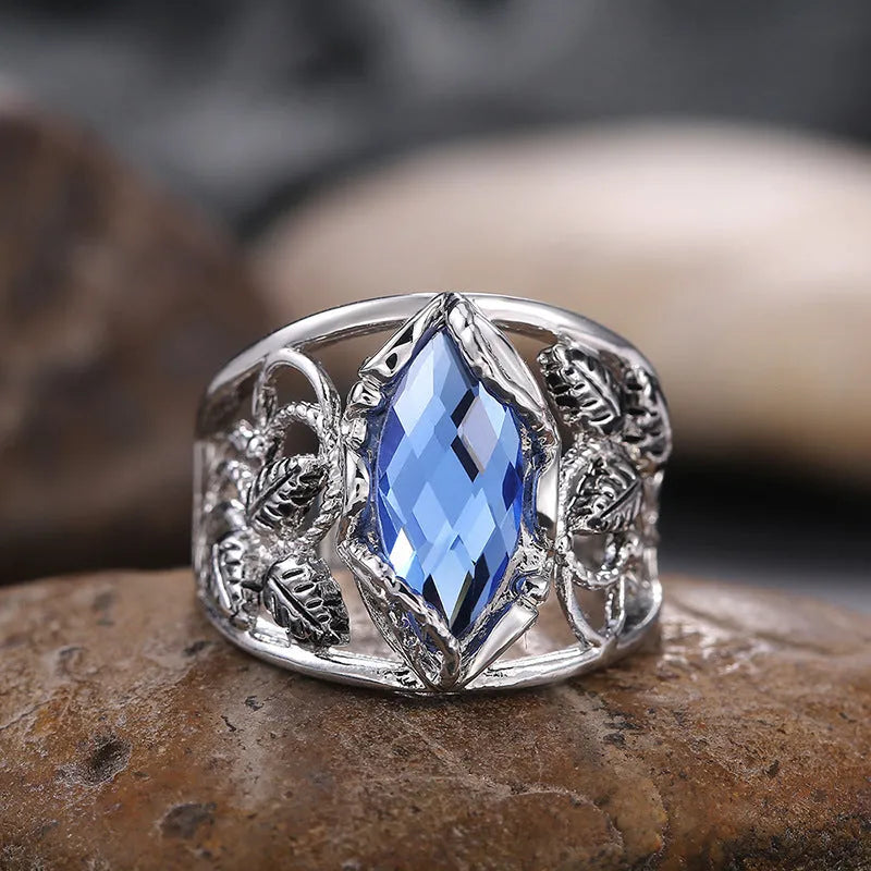 Blue horse eye geometric alloy women's ring with crystal inlay detailing showing side profile