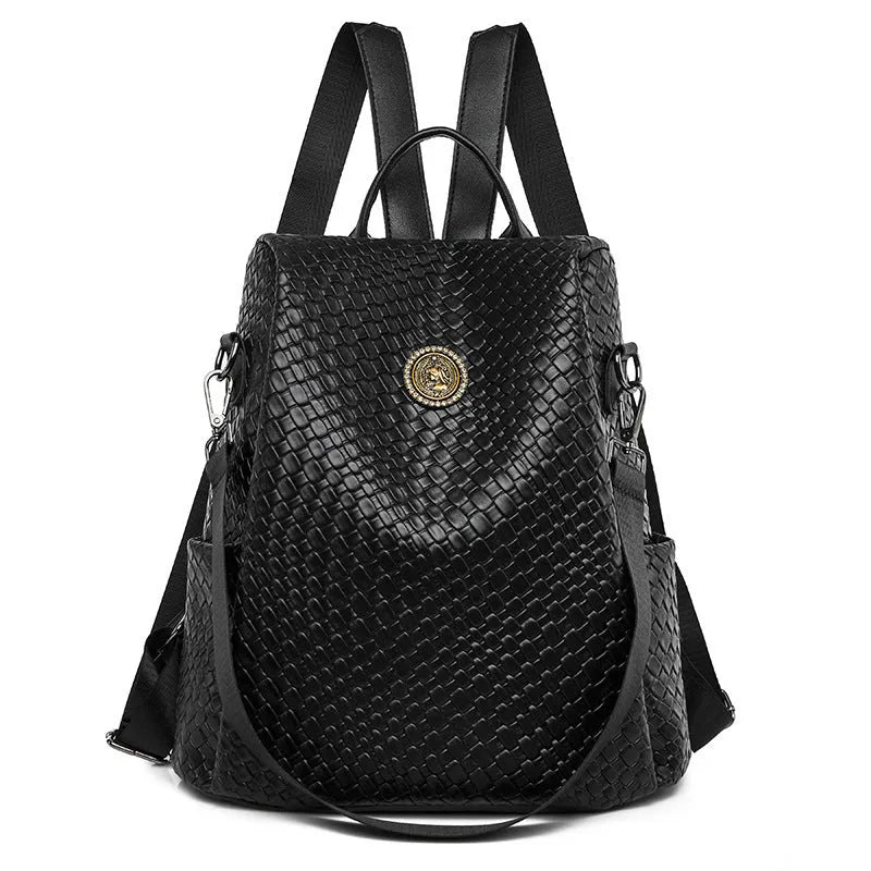 Women's black waterproof anti-theft backpack showing organisational interior compartments
