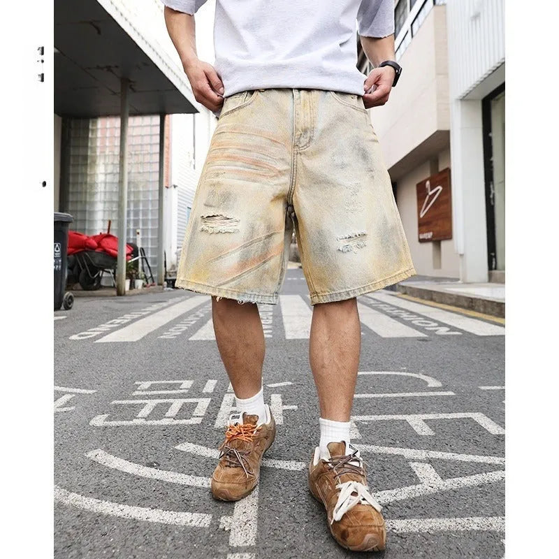 Men's light blue ripped denim shorts with straight leg style and mid-waist fit