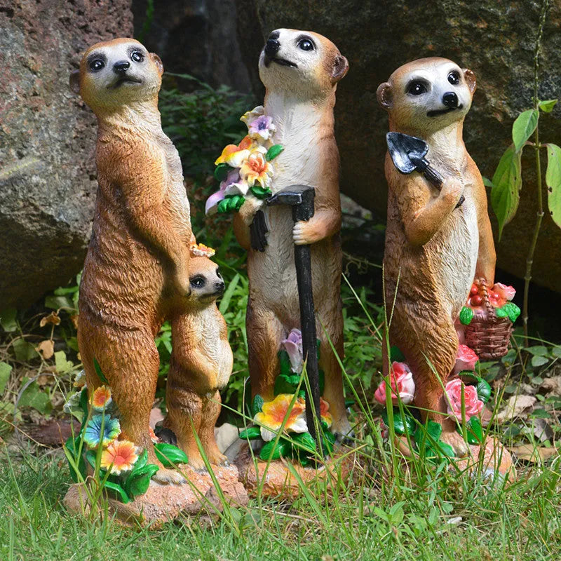 Yellow brown synthetic resin mongoose garden ornament wearing a straw hat and holding a rake or shovel for bonsai decoration