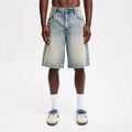 Men's loose straight-leg jeans in light blue denim on a neutral background