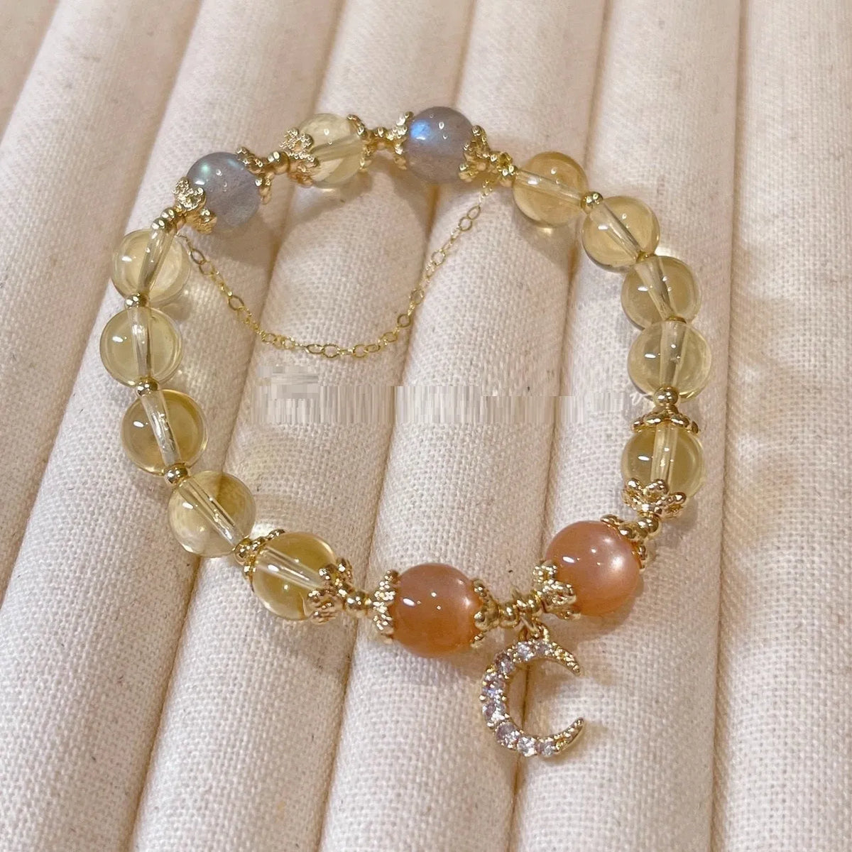Chinese style crystal bracelet with 14K gold electroplated finish and diamond-shaped design
