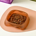 Blue slow feed anti-choke dog bowl with raised centre pattern on a non-slip base.