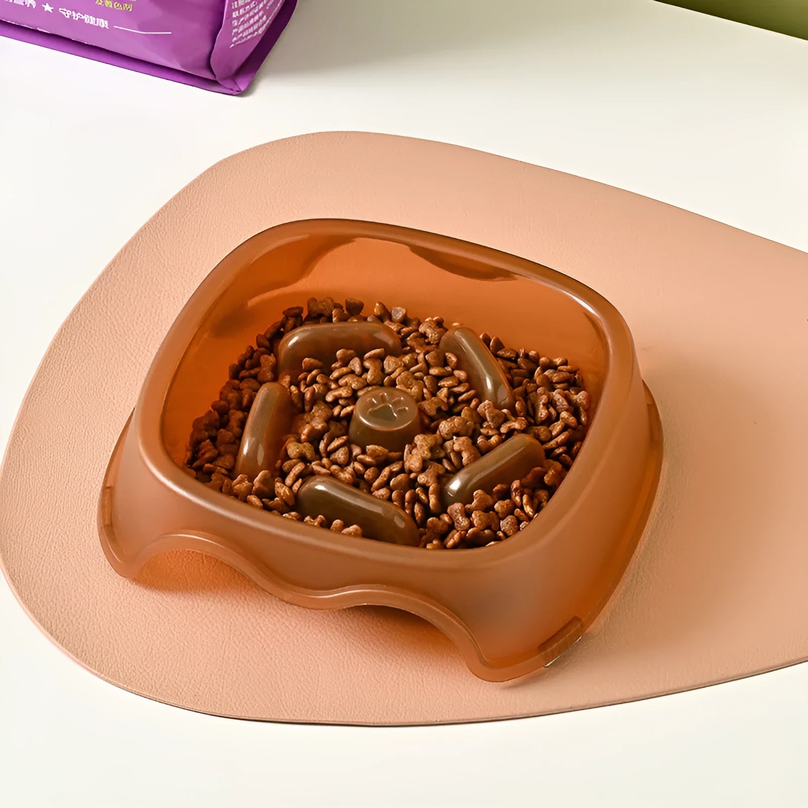 Blue slow feed anti-choke dog bowl with raised centre pattern on a non-slip base.