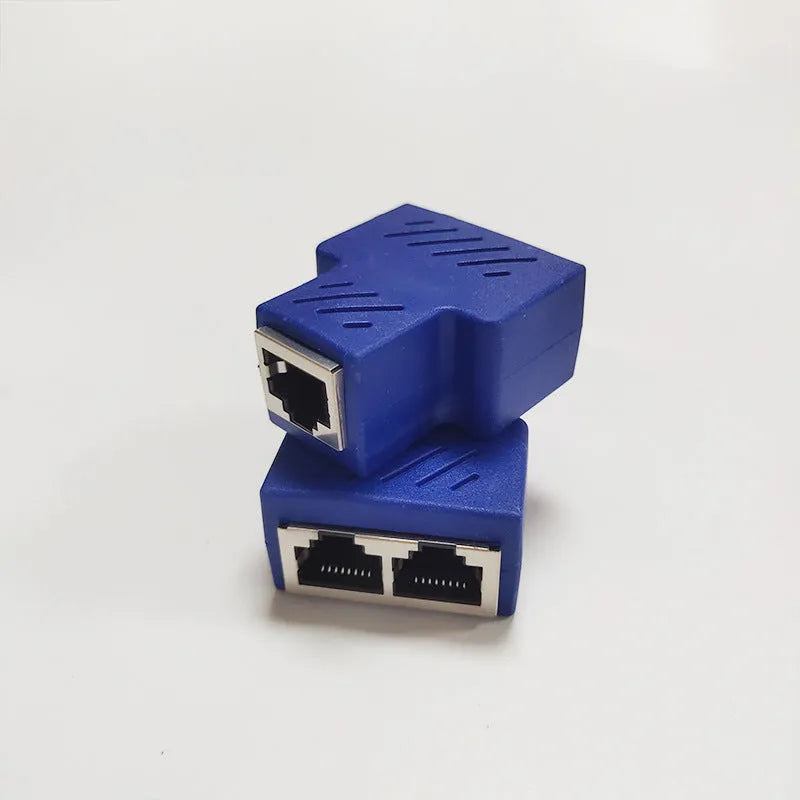 Two white RJ45 network cable splitters, showing one input and two output ports.