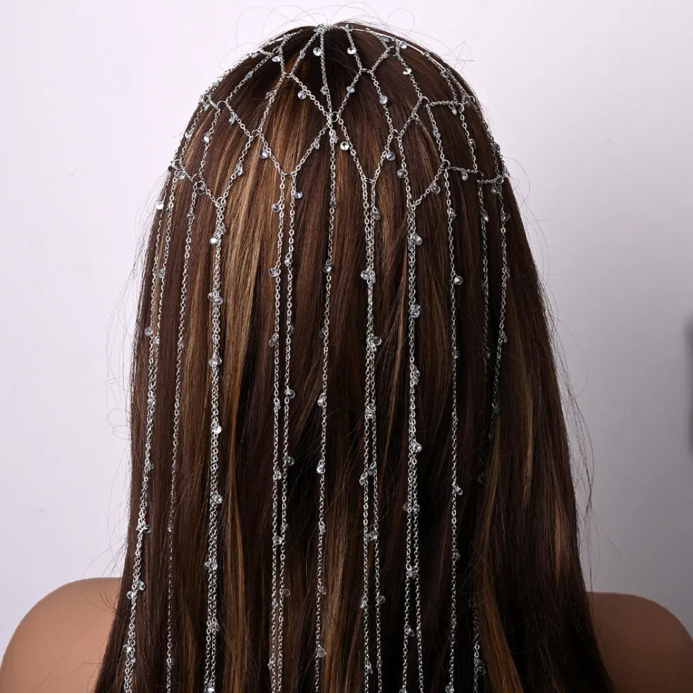 Gold and silver rhinestone mesh hair band with a tassel detail