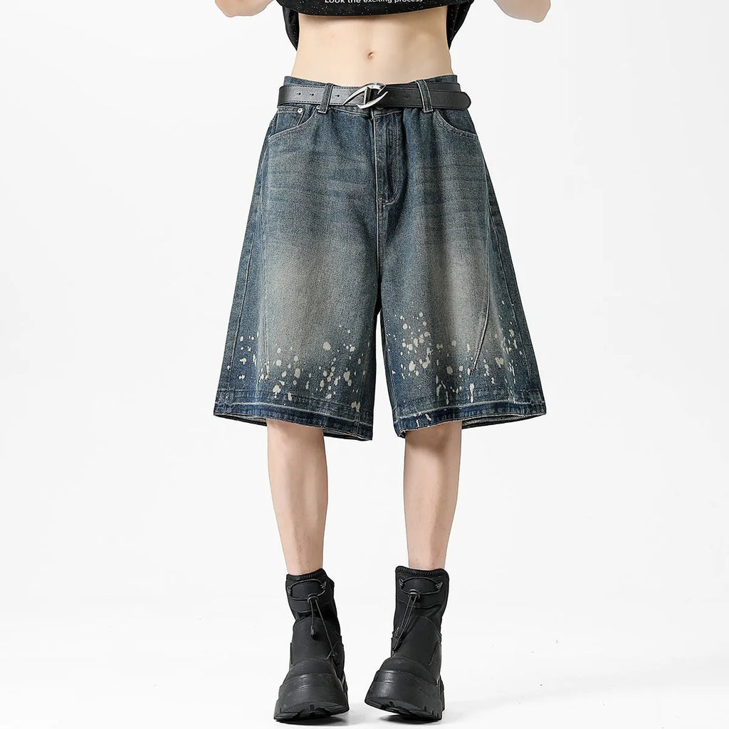 Men's retro blue denim shorts with ripped splash ink pattern and straight cut design