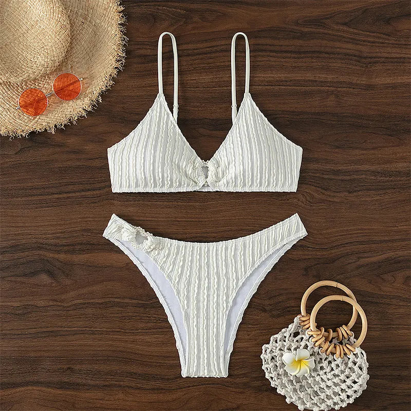 White women's V-neck split swimsuit with sleeveless design and matching shorts