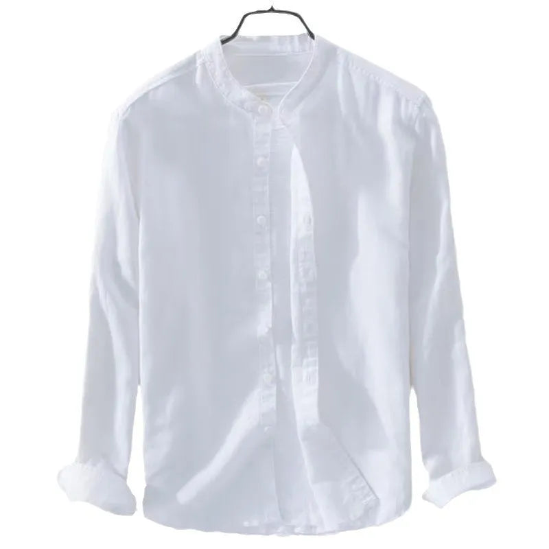 Man wearing a loose fit light blue cotton linen long sleeve casual shirt.