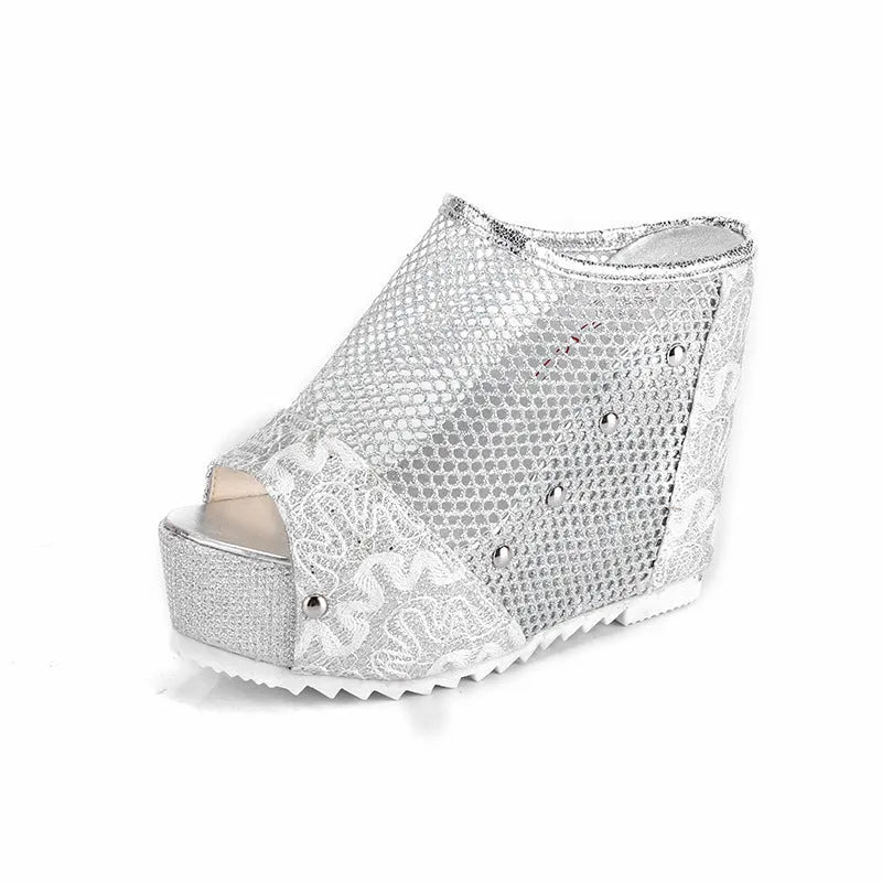 Women's black platform sandals with a lace-up ankle strap and hollowed-out chunky heel.