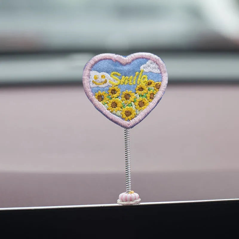 Set of six small yellow PVC duck figurines and one plastic sign for car dashboard decoration.