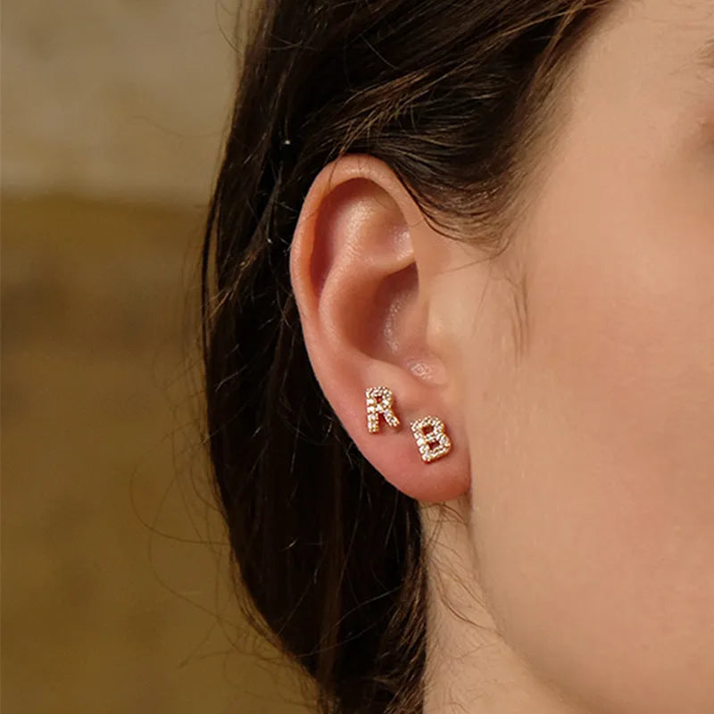 Gold plated alphabet letter earrings showing English characters A to Z with zircon decorative accents
