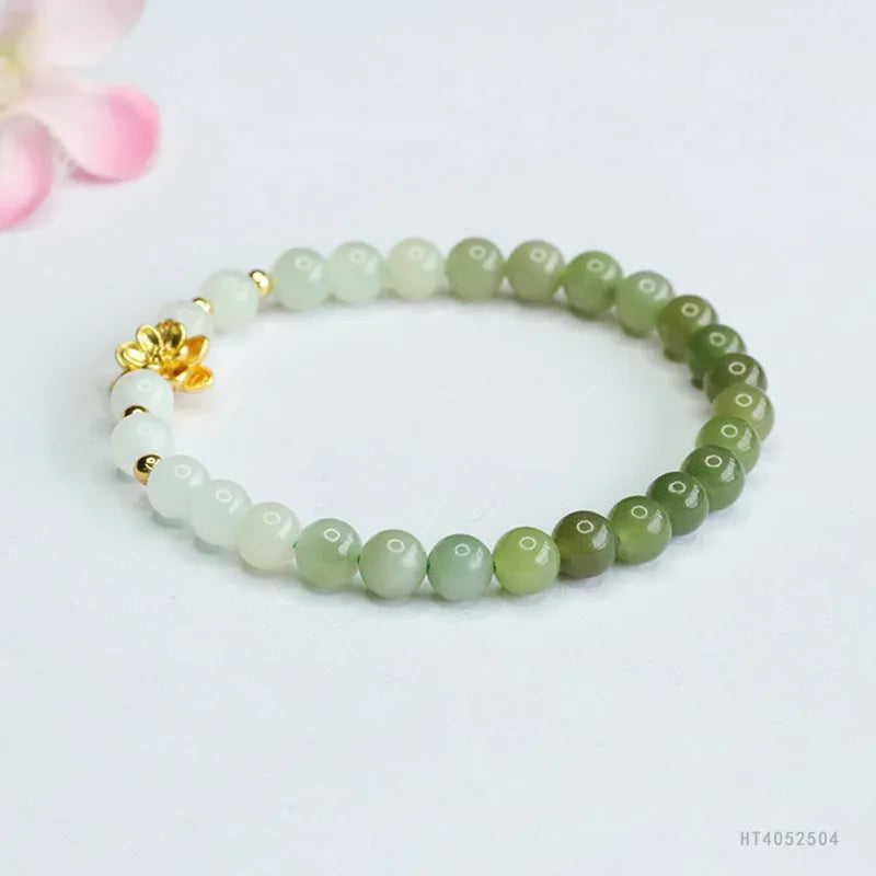 Hand-woven Hetian jade bracelet with sunshine water gradient colour and floral design.