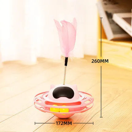 Pink cat stick toy with a tumbler turntable design on a white surface.