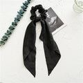 Spring dark green cloth ribbon hairband with large intestine ring design laid flat