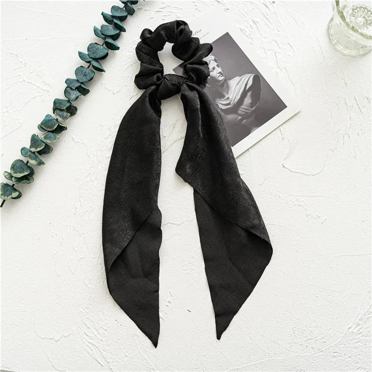 Spring dark green cloth ribbon hairband with large intestine ring design laid flat
